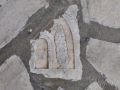 Pyrgos, Tinos, reliéf na mramorovej dlažbe